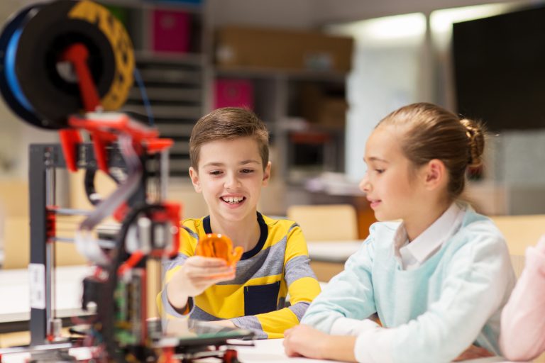 education, children, technology, science and people concept - group of happy kids with 3d printer and plastic detail prototype at robotics school lesson